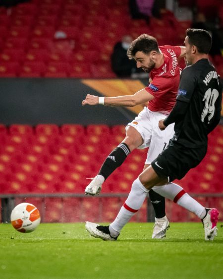 Bruno Fernandes takes a shot in the game against Granada in the UEFA Europa League.